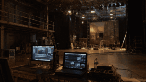 Behind the scenes of a live entertainment production set representing the operational risks covered by entertainment liability insurance.